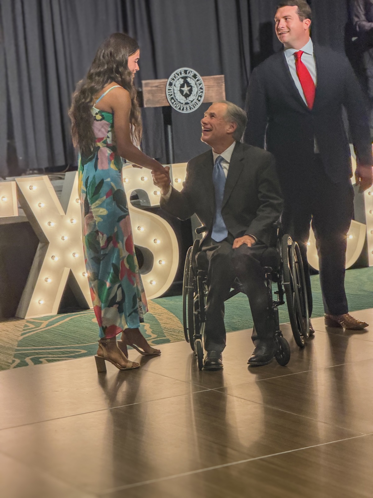 A TXST CIM student greets Texas Gov. Greg Abbott at the Concrete Industry Management Scholarship Gala