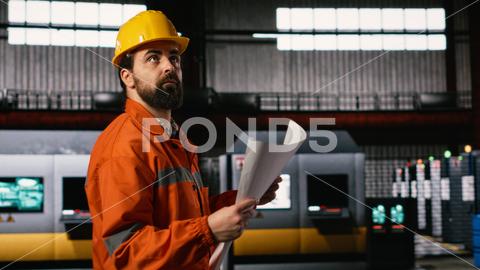 A worker monitoring environmental conditions at an aggregate facility
